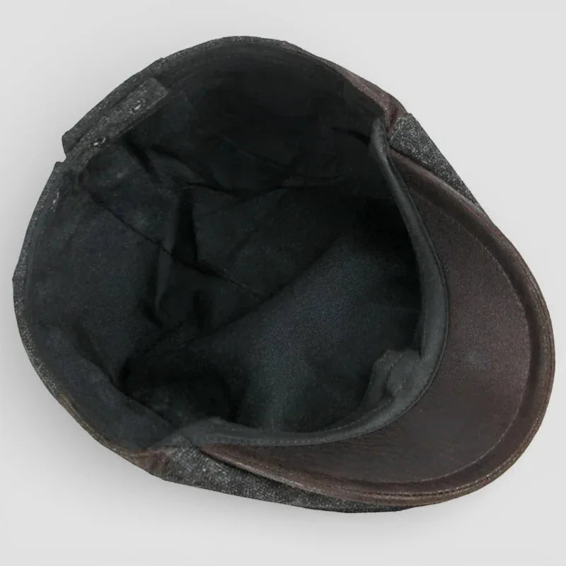 Dark brown leather beret cap with textured worn finish and black lining