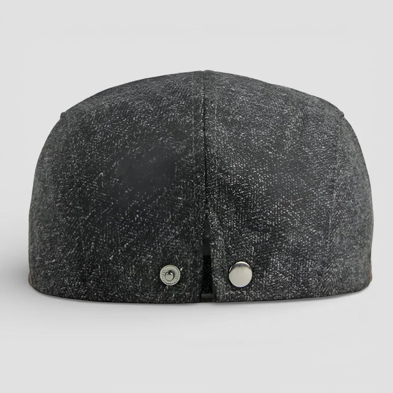 Back view of dark gray textured Leather Beret Cap with metallic snap buttons