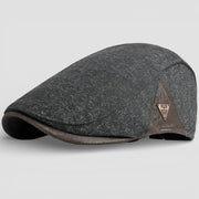 Dark gray tweed flat cap with brown leather brim and logo patch for Leather Beret Caps