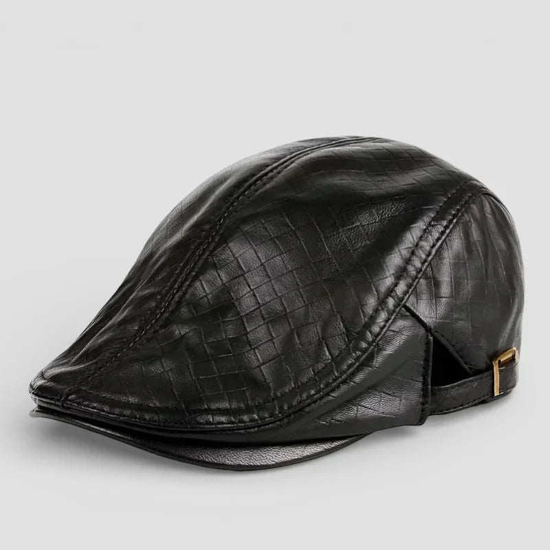 Black leather flat cap with woven texture and gold-tone buckle