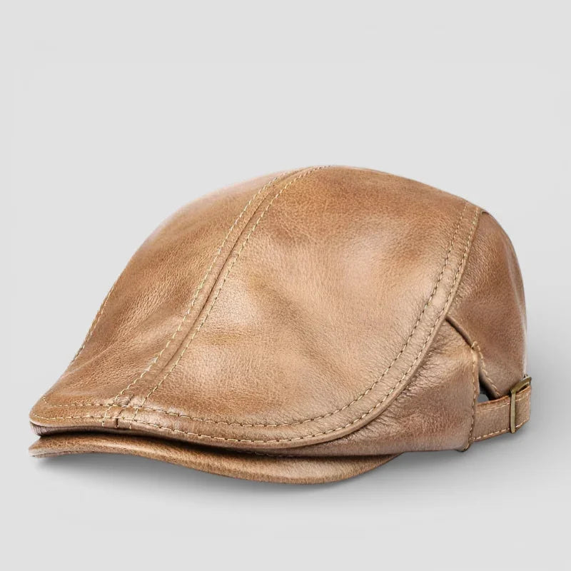 Tan leather flat cap with visible stitching and adjustable strap for men