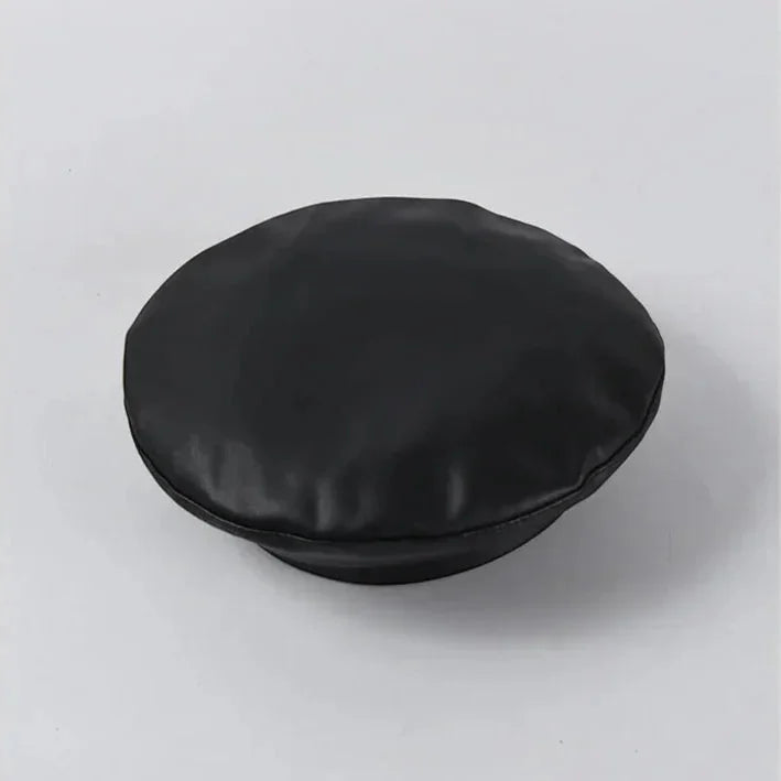 Black faux leather beret with smooth glossy finish and rounded crown