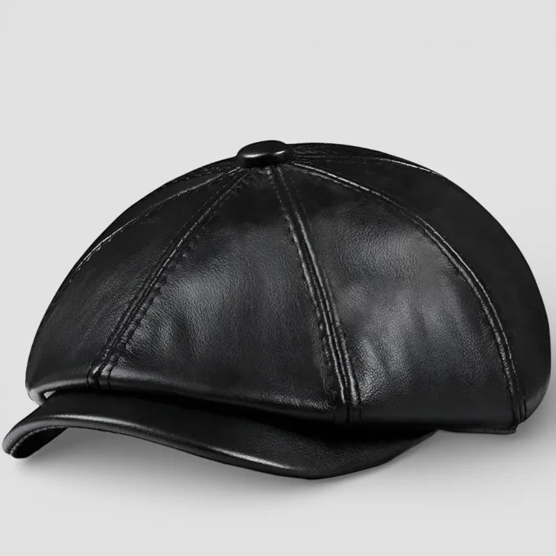 Black leather eight-panel newsboy hat with curved brim and stitched seams