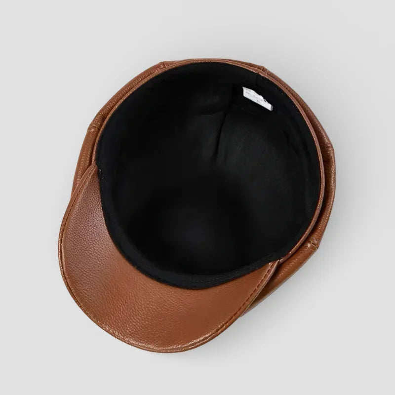Brown leather newsboy hat with black interior lining