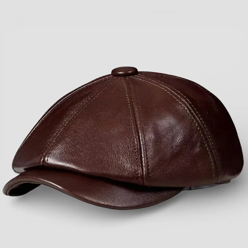 Brown leather newsboy hat with six-panel design and stitched seams