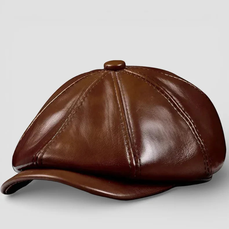 Brown leather newsboy hat with six-panel design and curved brim