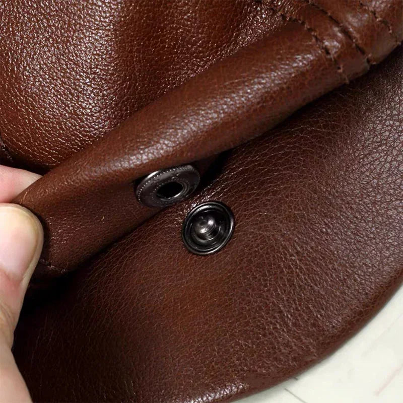 Brown leather with metal snap.