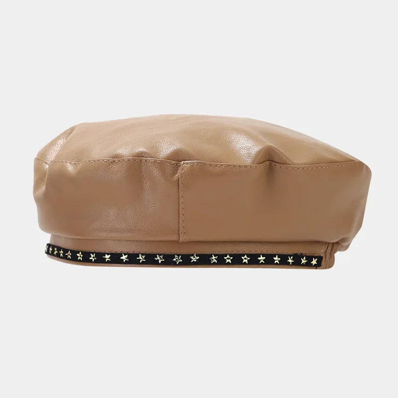 Beige beret with star embellishments.