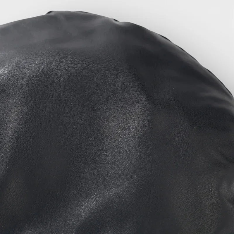 Black leather beanbag chair with glossy finish and Leather Trim Beret stitching