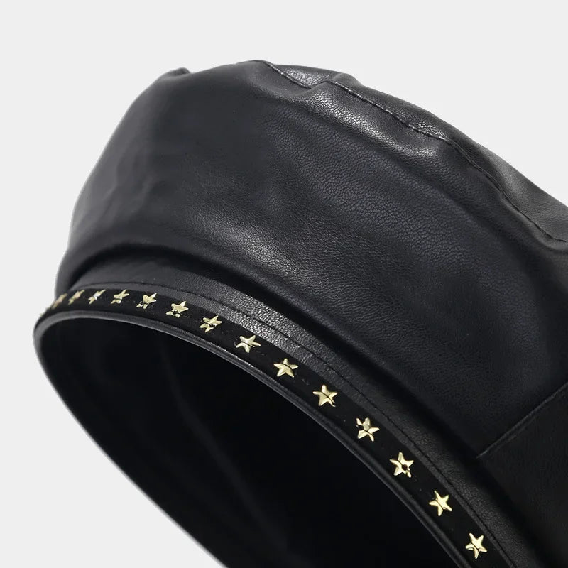 Black leather beret with star embellishments.