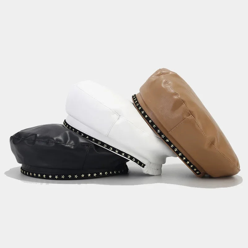 Three leather berets with studded trim.