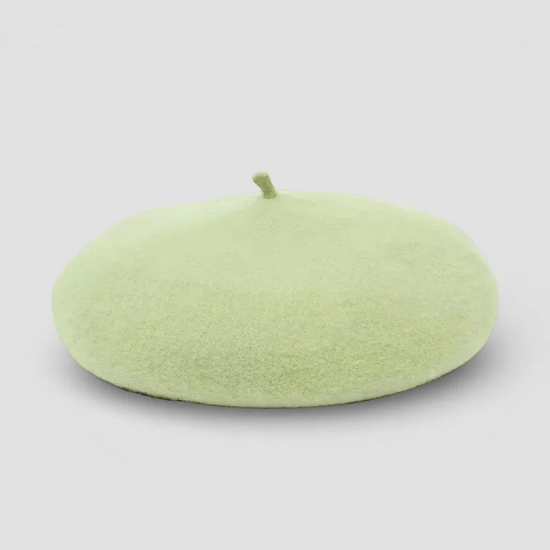 Light green beret with smooth felt texture and top button