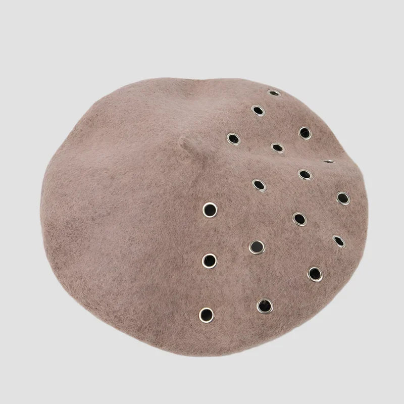Taupe beret with grommets.