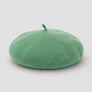Mint green felt beret with small matching button on top