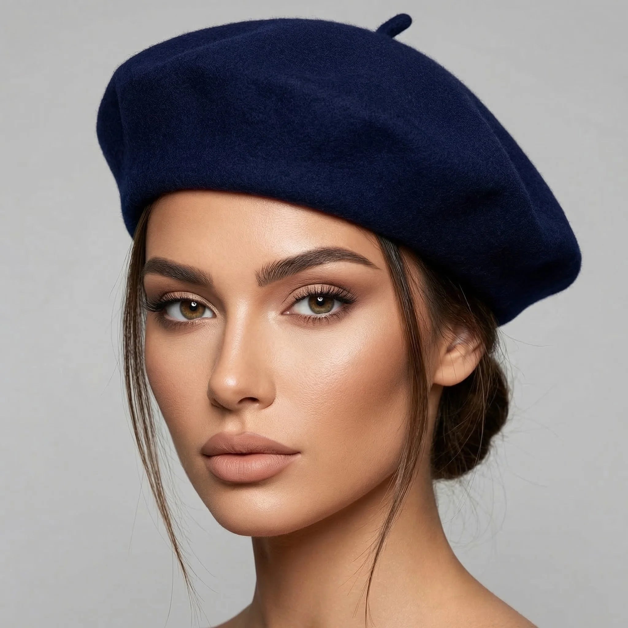 Navy blue wool beret with soft rounded crown and top button