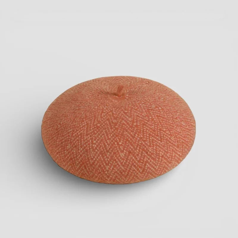 Orange French wool beret in terracotta with textured herringbone pattern