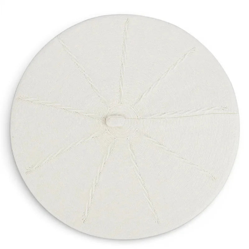 White textured circular coaster with radiating lines for Original French Beret