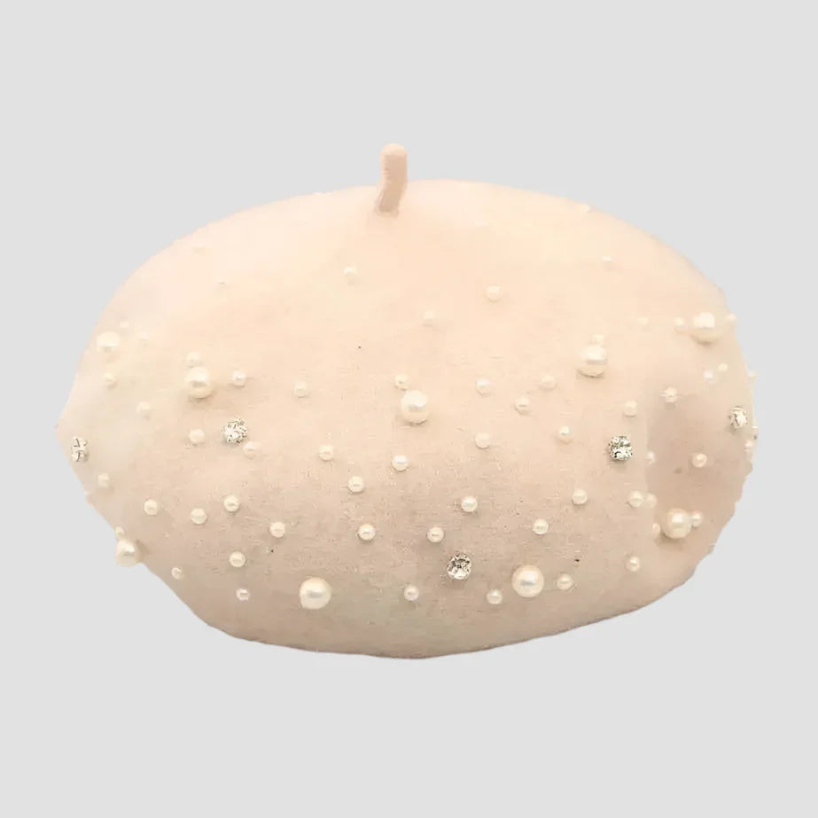 Beige beret with pearls and rhinestones.