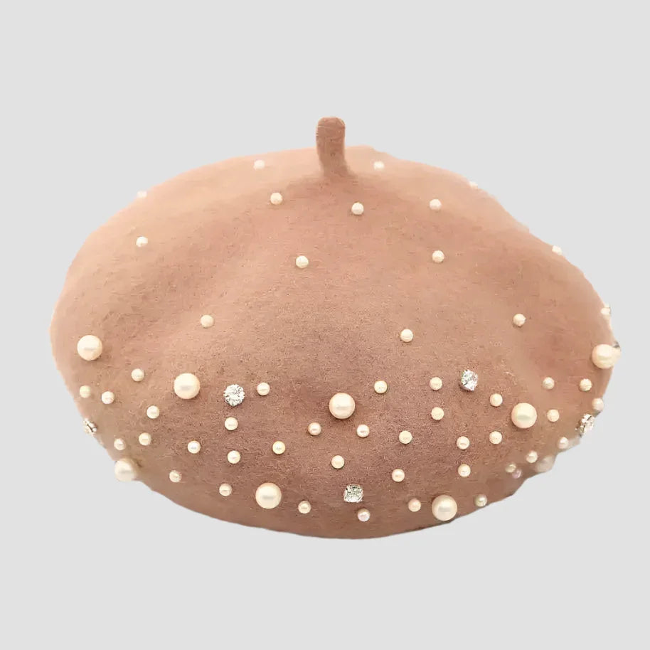 Pink beret with pearl and rhinestone embellishments.