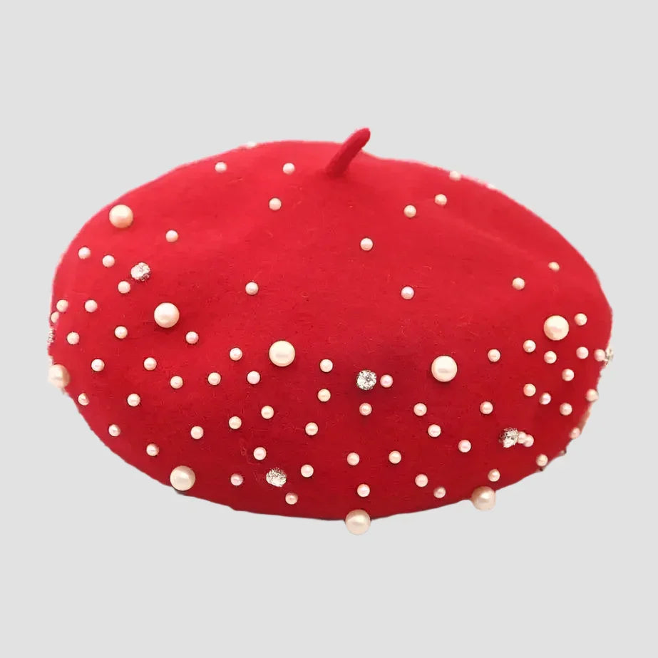 Red beret with pearl and rhinestone embellishments.