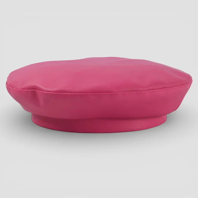 Pink leather beret in vibrant fuchsia with glossy finish and stitched brim