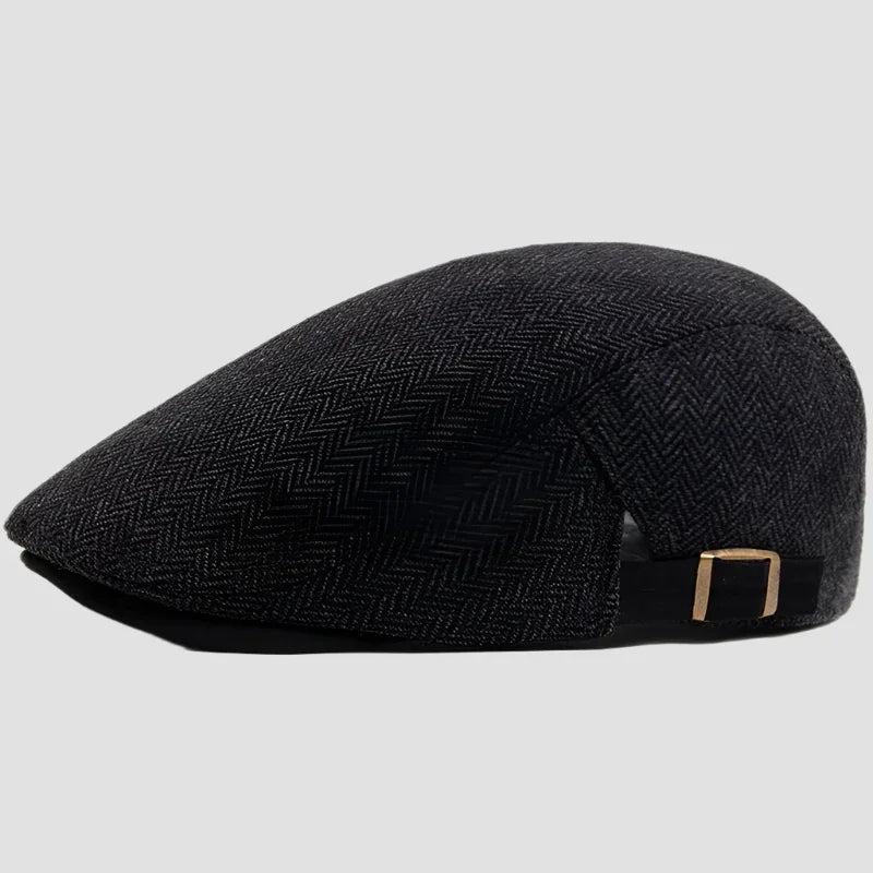 Dark herringbone flat cap.