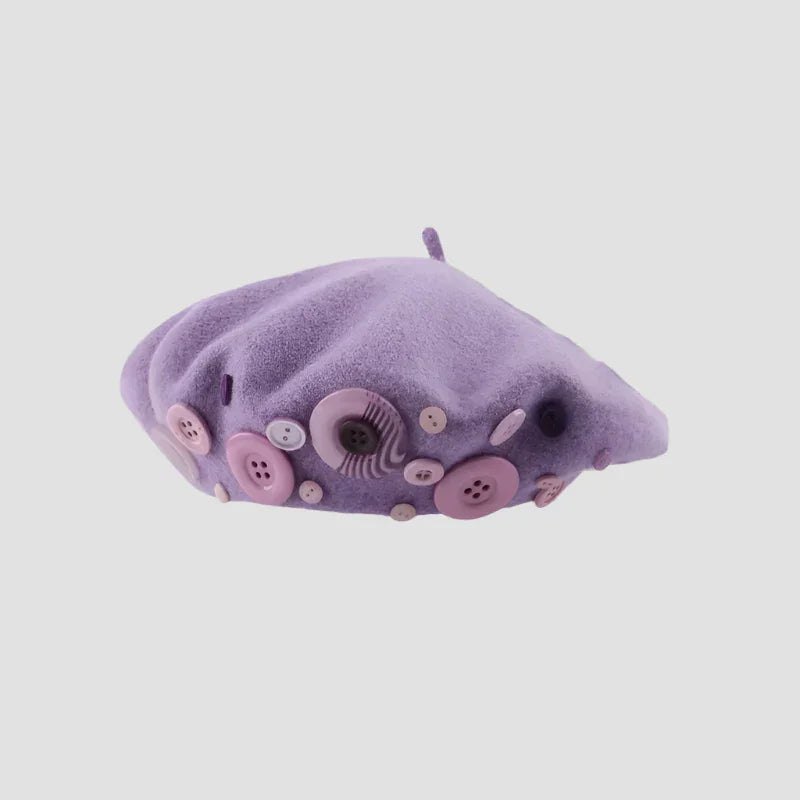 Lavender beret with button embellishments.