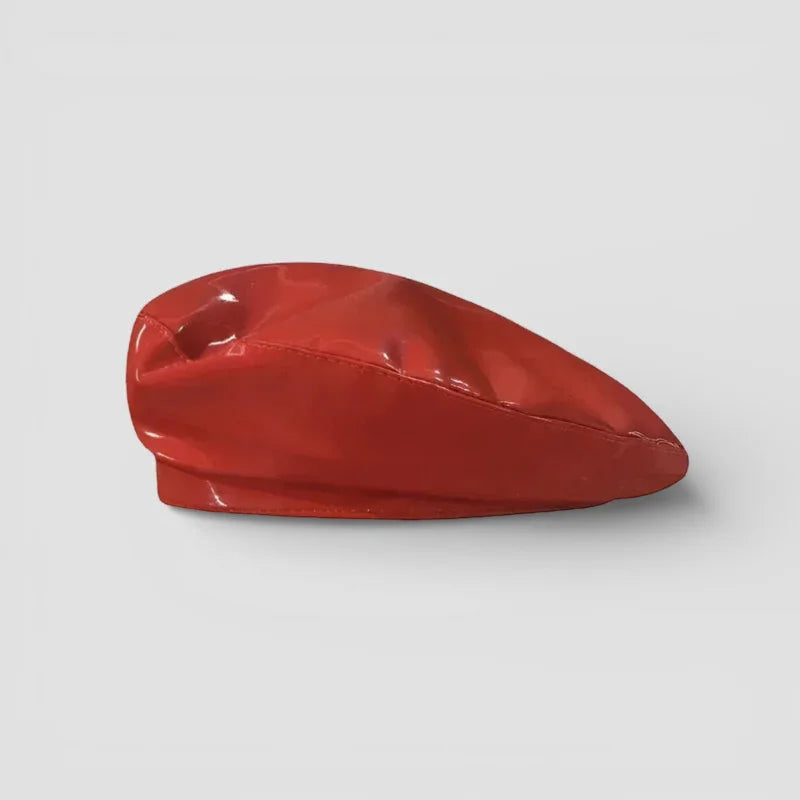 Glossy red leather beret with smooth reflective surface and subtle creases