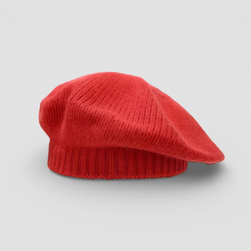 Vibrant red corduroy beret with ribbed texture and soft folded brim