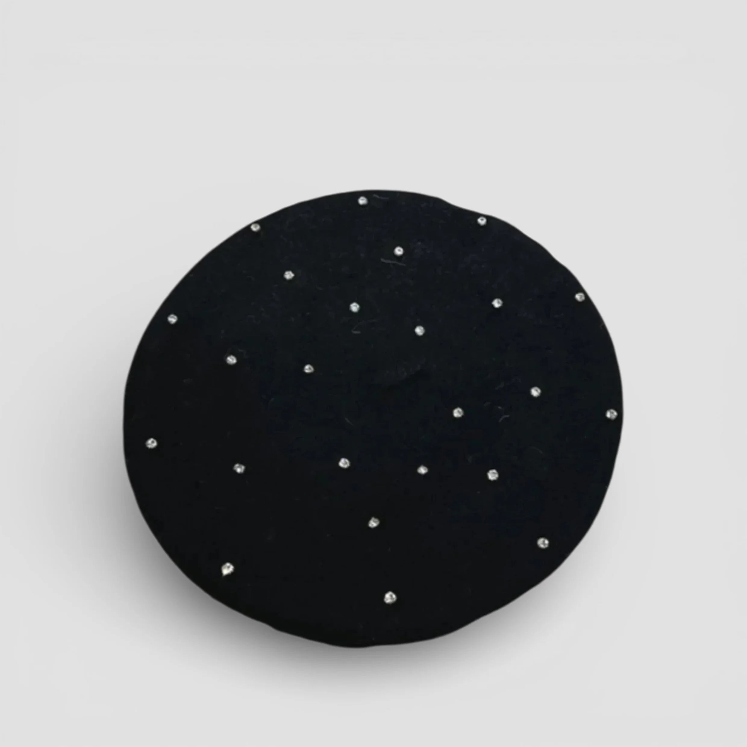 Black circular Rhinestone Beret brooch with scattered silver rhinestones
