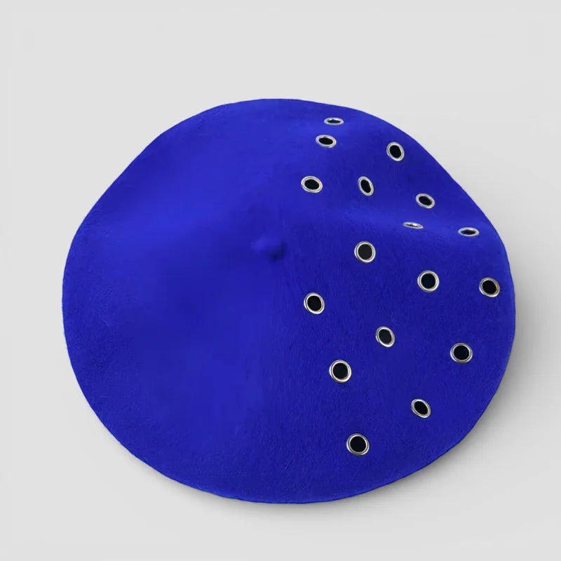 Vibrant royal blue suede beret with asymmetrical silver grommets