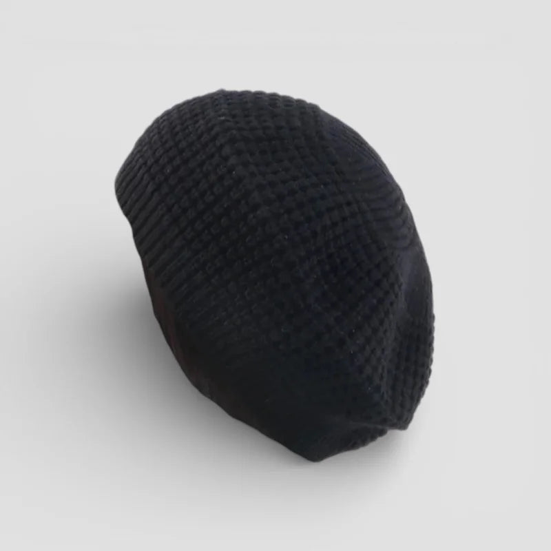 Black knitted beret with textured woven pattern from Simple Beret Crochet Pattern