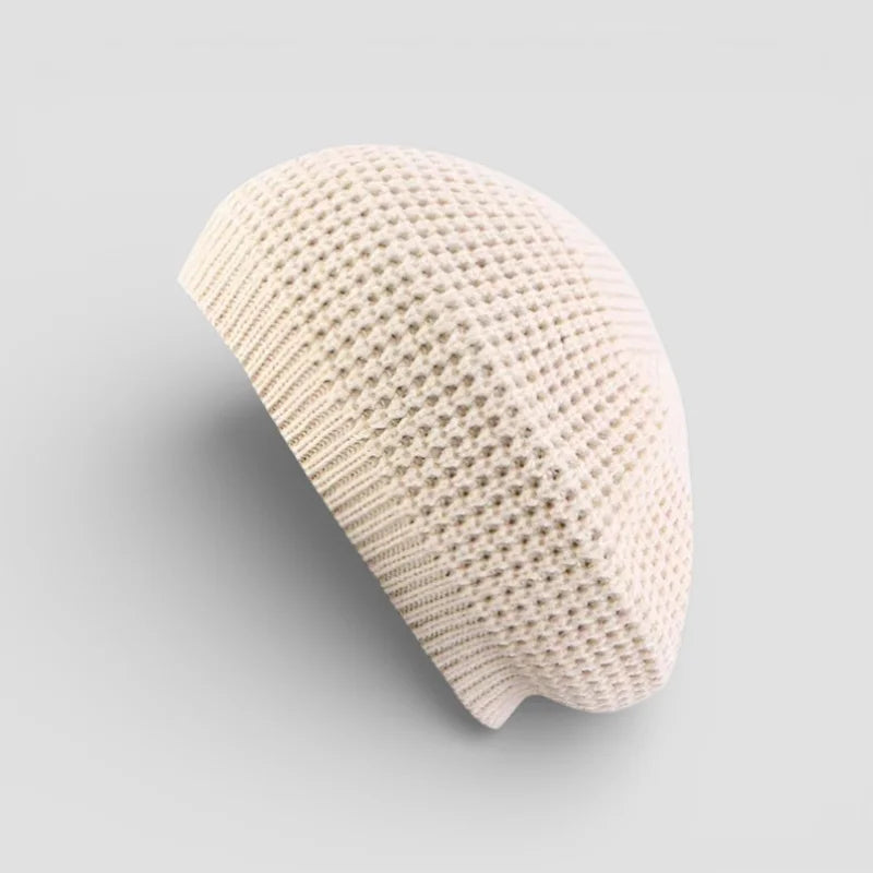 Cream-colored open-weave knitted beret from Simple Beret Crochet Pattern