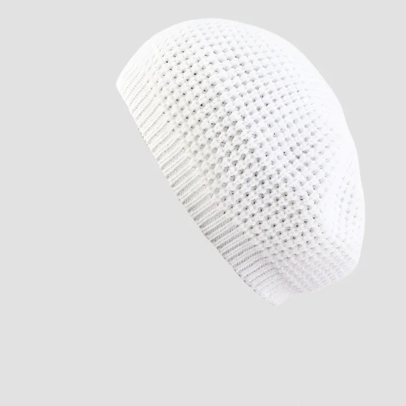 White knitted kufi hat.