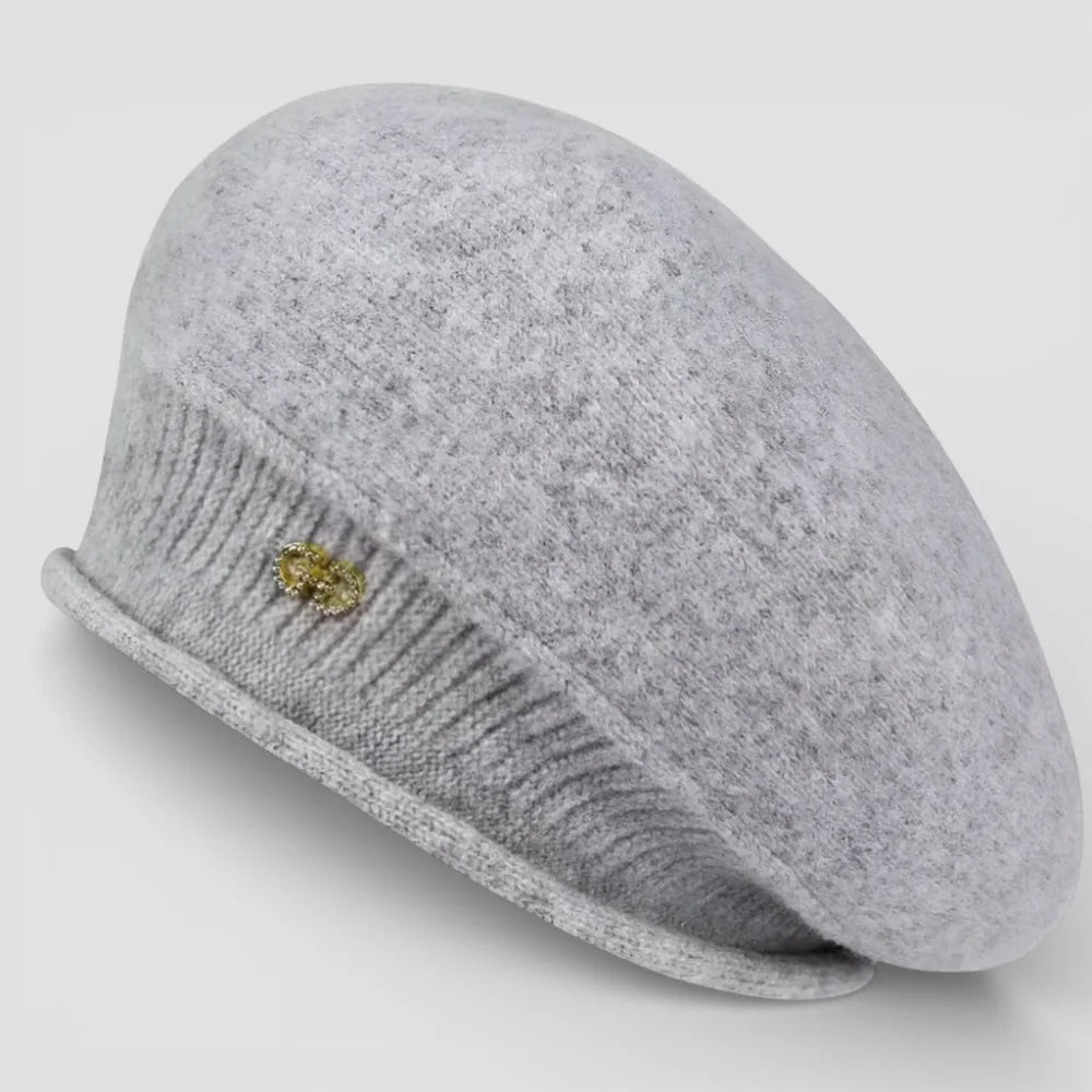 Slouchy wool beret in soft heather gray felt with ribbed brim and gold brooch