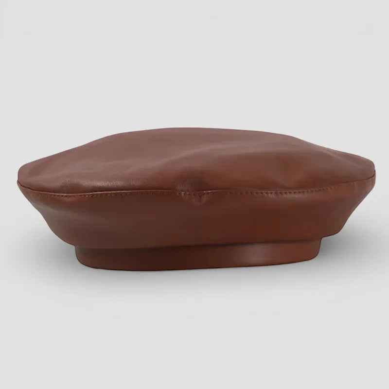 Tan leather beret with sleek brown design, soft rounded crown and subtle edge stitching