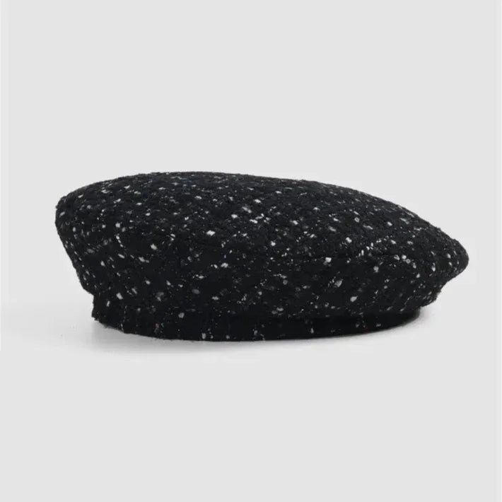 Black and white speckled beret.
