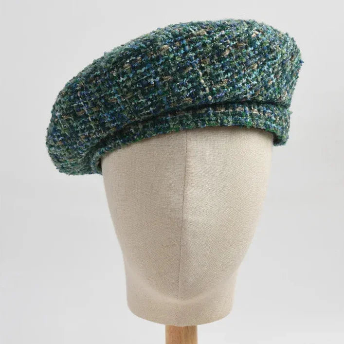Green tweed beret.