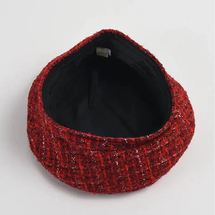 Red tweed beret with black lining.