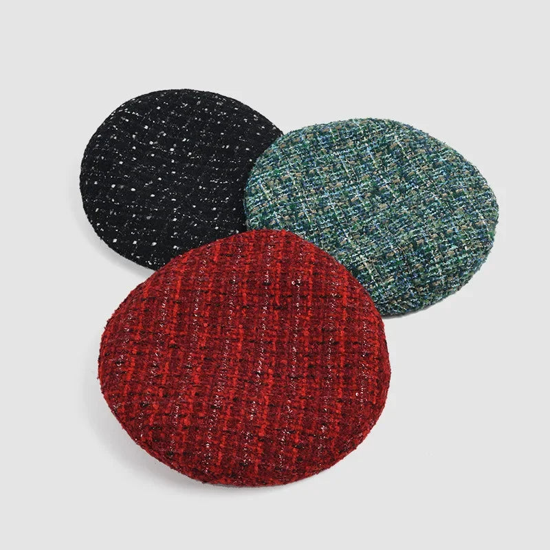 Three tweed berets.