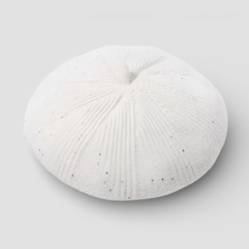 White ceramic sea urchin decor with ridges and speckles for Velvet Beret