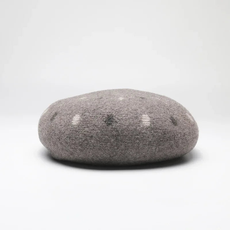 Gray felt beret with polka dots.