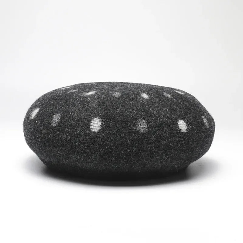 Gray felted beret with white polka dots.