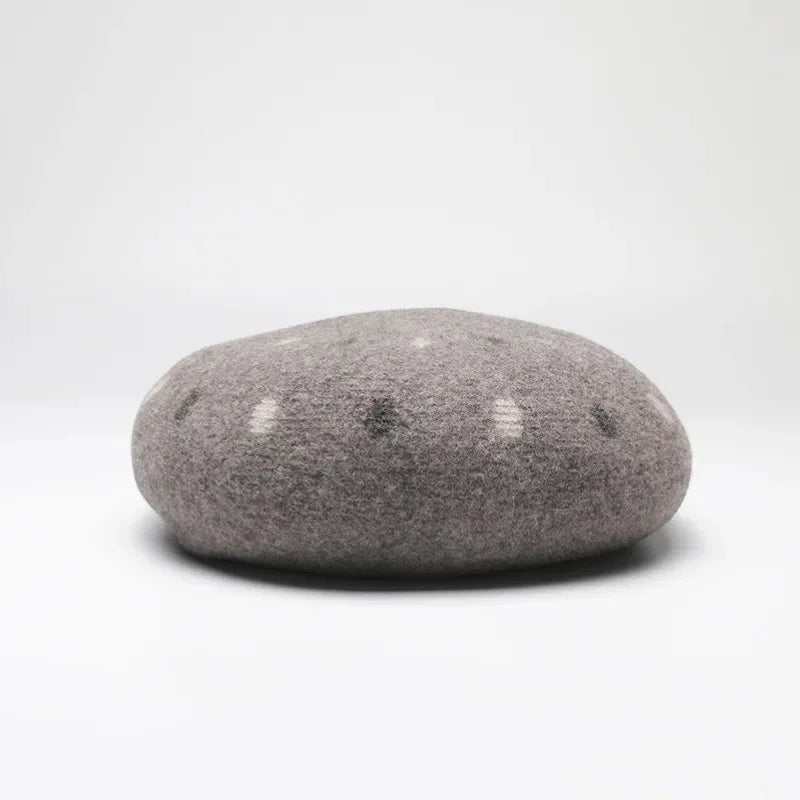 Vintage Basque Beret in smooth rounded gray speckled river stone texture