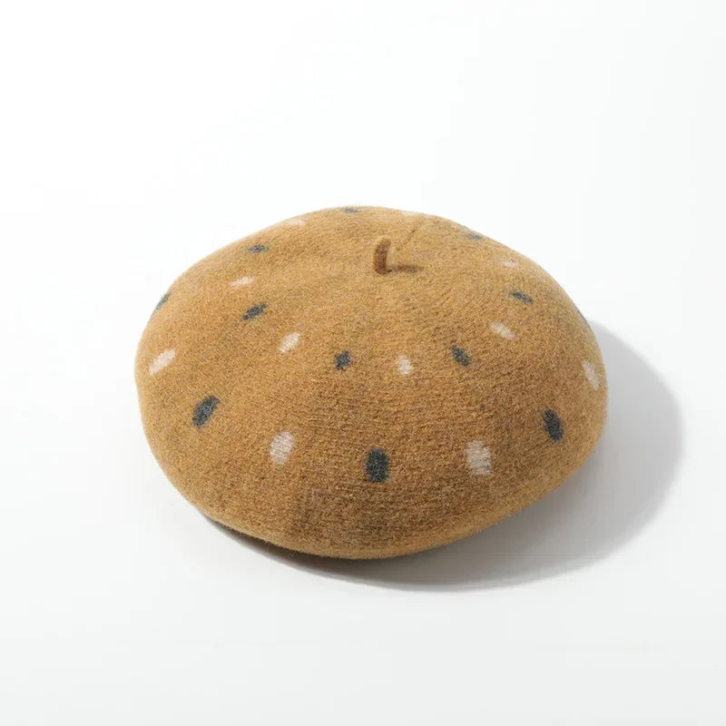 Tan beret with polka dots.