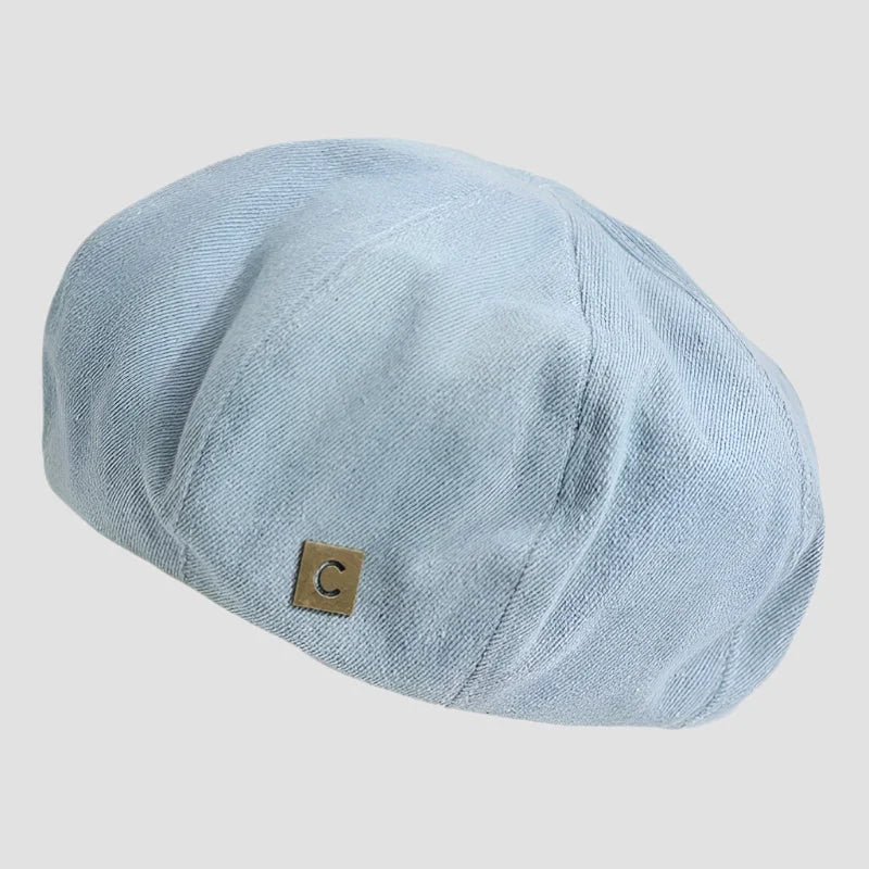 Light blue newsboy cap.