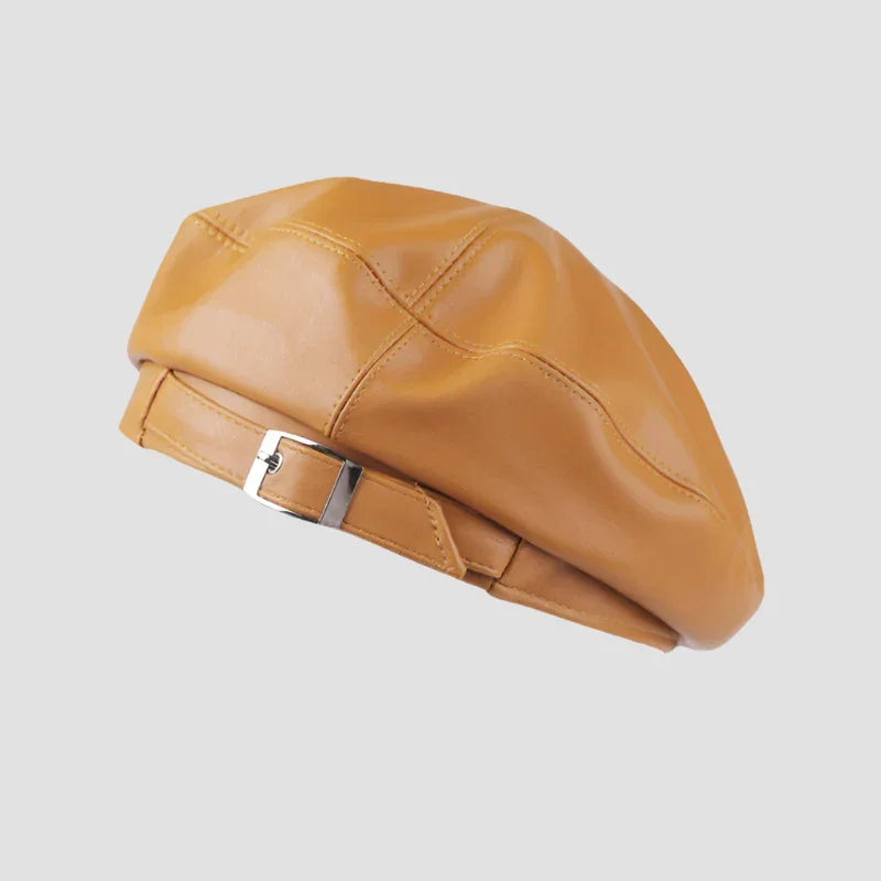 Mustard-yellow faux leather beret with buckle.