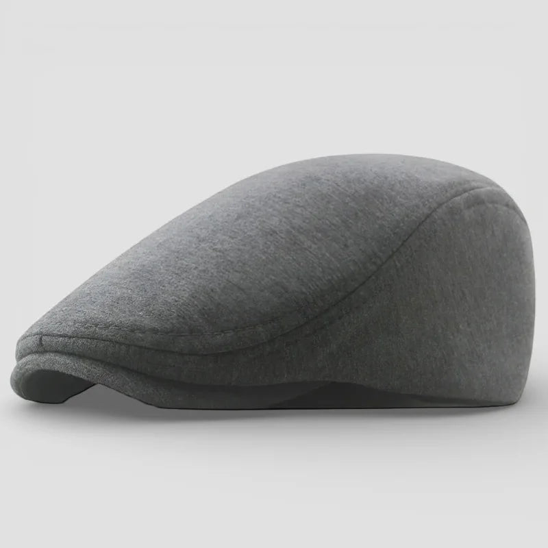 Sleek charcoal gray wool Winter Beret Cap with textured surface and stitched brim