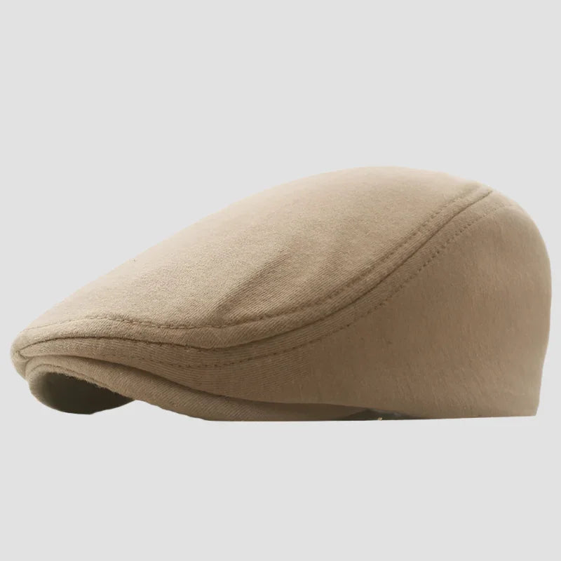 Tan flat cap.
