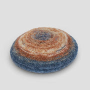 Circular hand-felted coaster with blue beige terracotta rings for Wool Beret Pattern